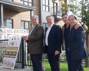 Montreal West mayor Beny Masella (left) cuts ribbon to open Brock Condominiums. With him are (from left) Sam Scalia, Pat Scalia, and Joseph Kobain. “The Scalias made a nice project here,” said Masella. ©John Symon 