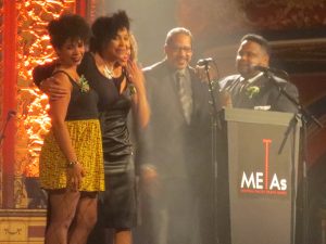 The chorus of the Centaur production of "The Adventures of a Black Girl in Search of God", accepting their Outstanding Contribution to Theatre METAs award 