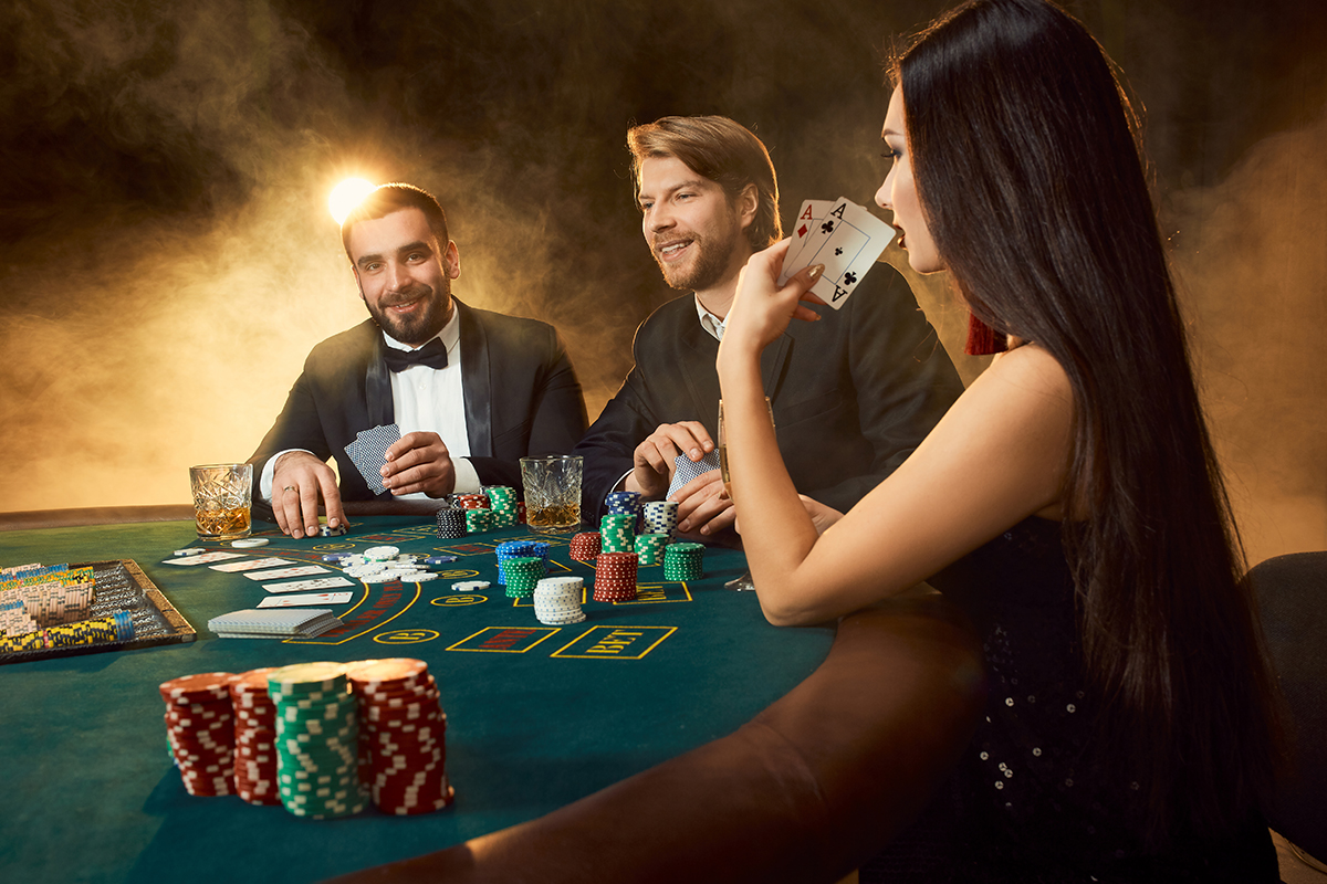 group-young-rich-people-is-playing-poker-casino-two-men-business-suits-young-woman-black-dress-smoke-casino-poker.jpg