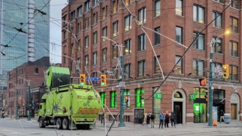 Garbage truck hits streetcar wires