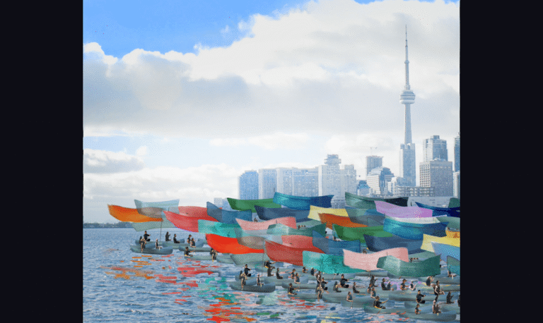 Over 100 canoes paint Lake Ontario